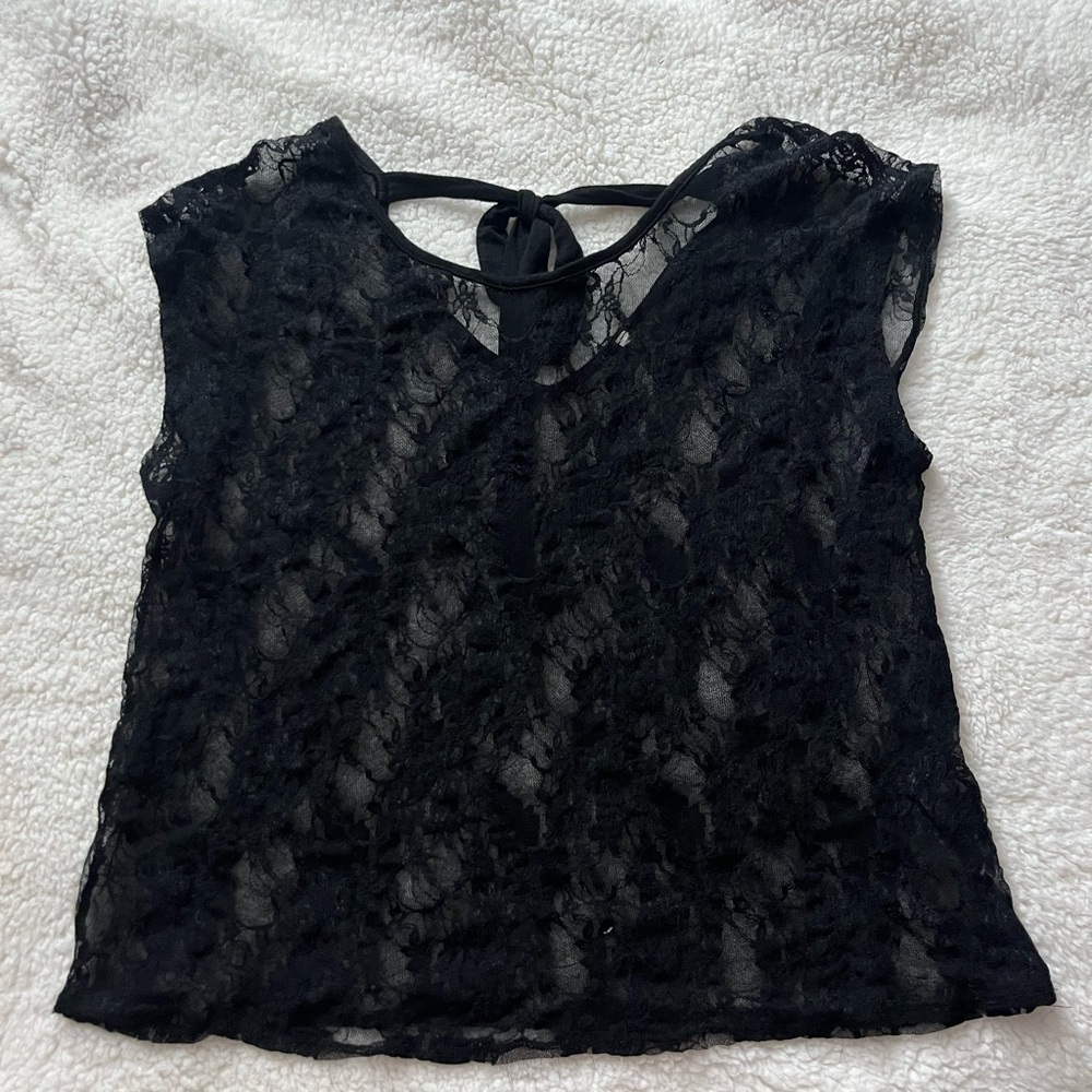 Black lace over the top shirt with a cute bow tie on the back! It is a size L!